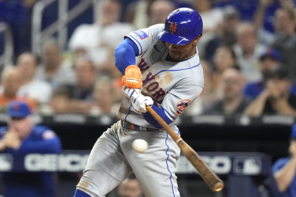 New York Mets' Francisco Lindor hits a single during the eighth inning of a baseball game against the Miami Marlins, Monday, Sept. 18, 2023, in Miami. (AP Photo/Lynne Sladky)