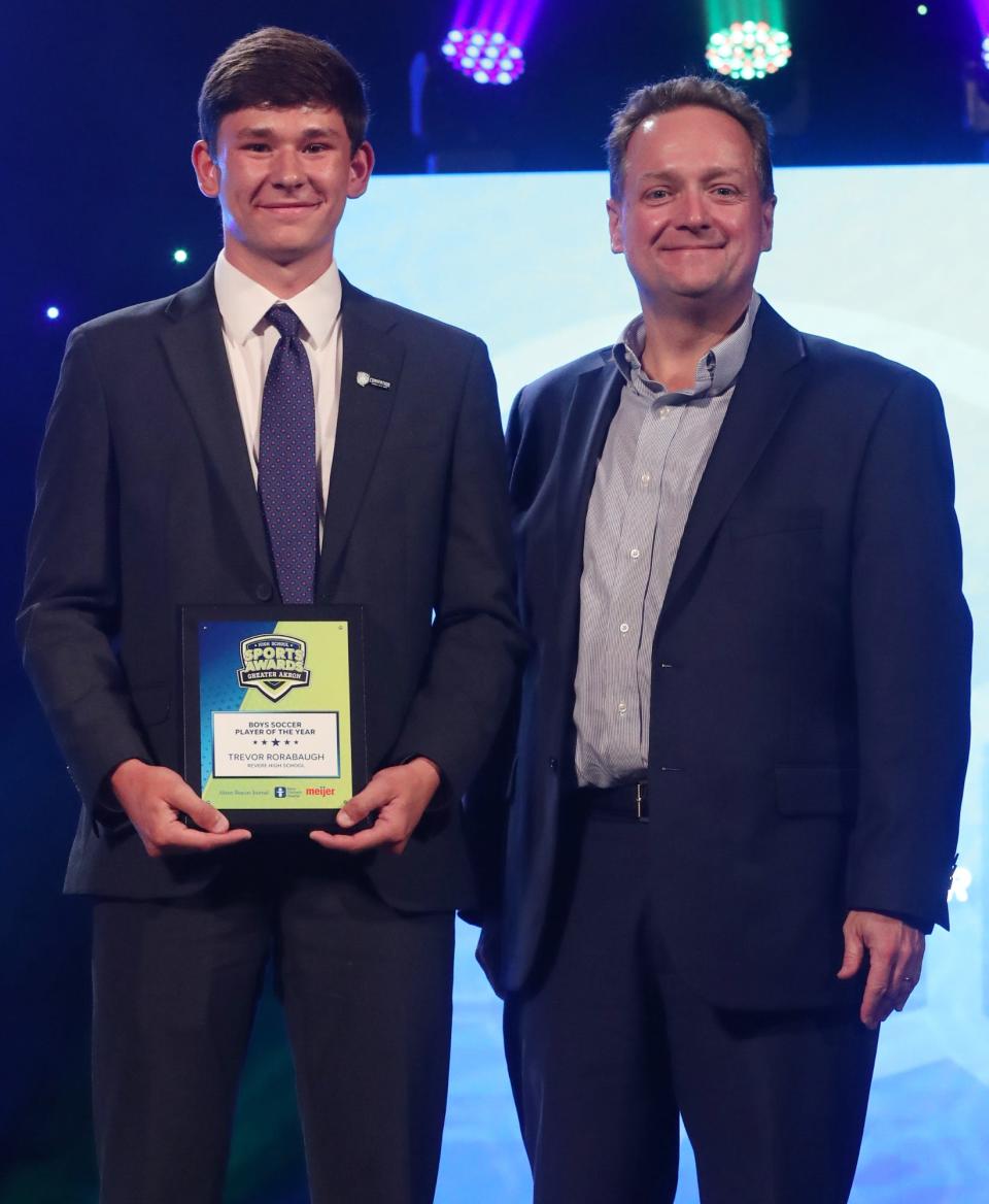 Revere High's Trevor Rorabaugh Greater Akron Boys Soccer Player of the Year with Michael Shearer Akron Beacon Journal editor at the High School Sports All-Star Awards at the Civic Theatre in Akron on Friday.