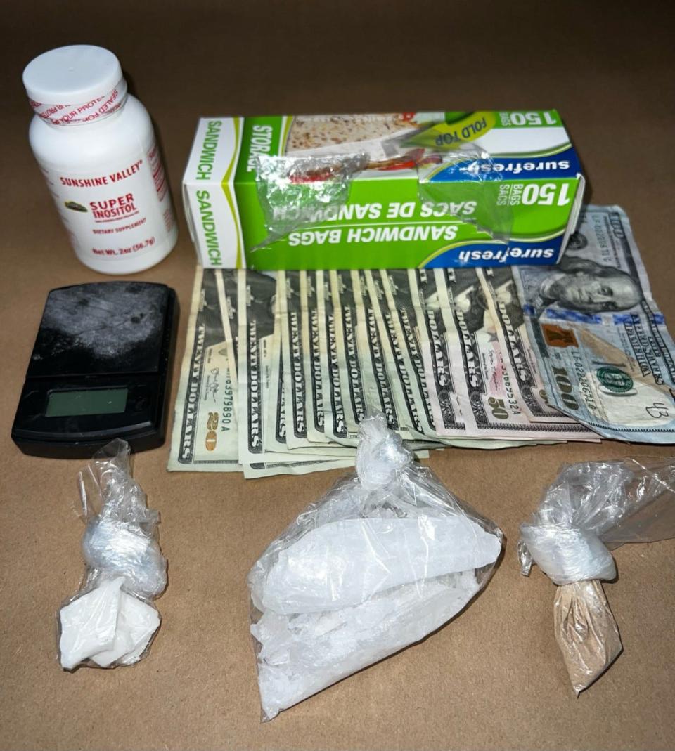 Money and drugs were found in the car driven by Kurtis Elliot, who rammed a Daytona Beach patrol vehicle on Tuesday. Elliott was wanted in connection with a homicide in Holly Hill and tried to escape.