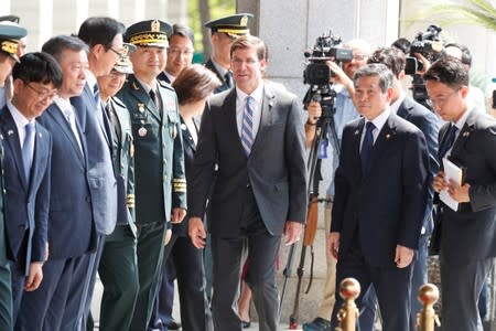 U.S. Secretary of Defense Mark Esper walks with South Korean Defence Minister Jeong Kyeong-doo as his arrives at the Defense Ministry in Seoul