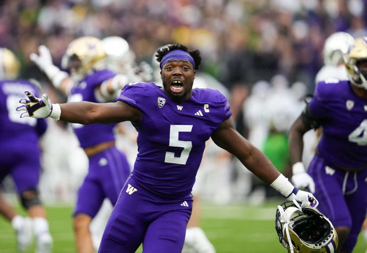 Washington linebacker Edefuan Ulofoshio (5) reacts after his team defeated Oregon on Saturday, Oct. 14, 2023, in Seattle. (AP Photo/Lindsey Wasson)