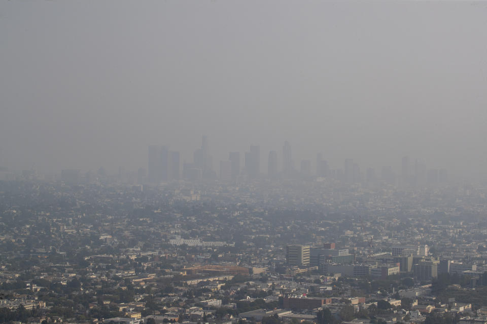 The view of downtown Los Angeles skyline is obscured by smoke, ash and smog as seen from the Griffith Observatory Monday, Sept. 14, 2020. / Credit: Allen J. Schaben / Los Angeles Times via Getty Images