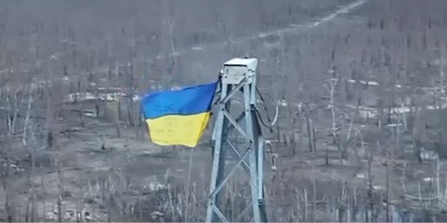 Soldiers of the Khartiia Brigade used a drone to fix the national flag of Ukraine on a power line pole in the Russian rear