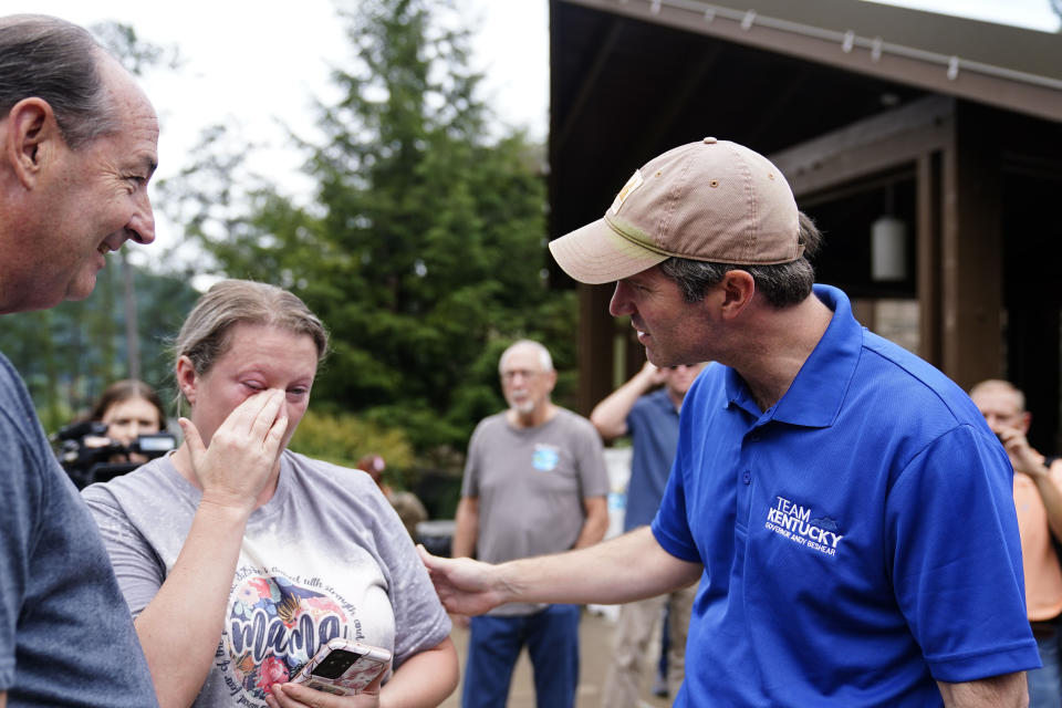 FILE - Kentucky Governor Andy Beshear, right, talks with Samantha Rowe, of Wayland, Ky., as she cries after being displaced by floodwaters at Jenny Wiley State Resort Park, Aug. 6, 2022, in Prestonsburg, Ky. (AP Photo/Brynn Anderson, File)