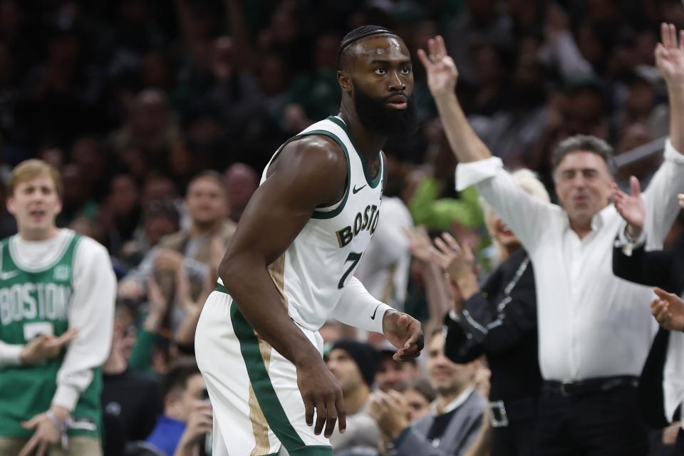 Boston Celtics owner Wyc Grousbeck, right, celebrates a 3-pointer by Jaylen Brown (7) against the Brooklyn Nets during the first half of an NBA basketball in-season tournament game Friday, Nov. 10, 2023, in Boston. (AP Photo/Michael Dwyer)