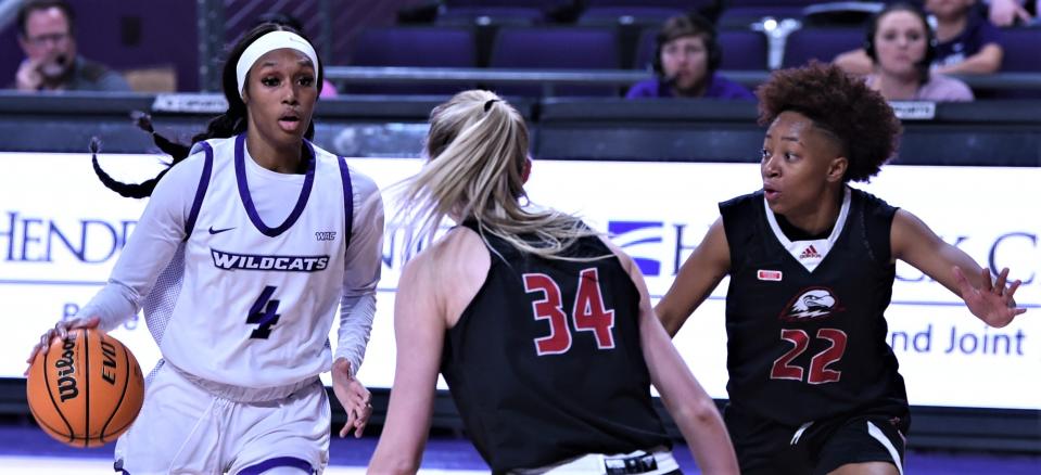 ACU's Maleeah Langstaff (4) looks to drive as Southern Utah's Samantha Johnston (34) and Daylani Ballena (22) defend in the second half.