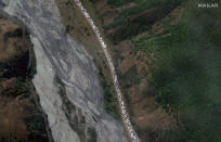 This satellite image provided by Maxar Technologies shows people and vehicles queuing for crossing the Upper Lars checkpoint on the Russian-Georgia border, on Tuesday Sept. 27, 2022, after Russian President Vladimir Putin announced a partial mobilization in Russia. (Satellite image ©2022 Maxar Technologies via AP)