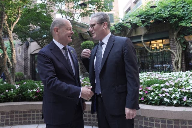 Sir Keir Starmer meeting German Chancellor Olaf Scholz in a landscaped area