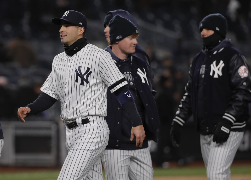 New York Yankees' Tyler Wade, left, celebrates with teammates after the Yankees beat the Detroit Tigers 3-2 in a baseball game, Monday, April 1, 2019, in New York. Wade was recalled from Scranton after Miguel Andujar was put on the 10-day injured list with a right shoulder strain. (AP Photo/Julie Jacobson)