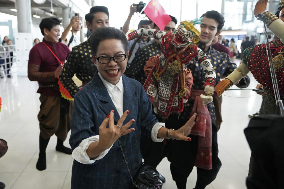 Chinese tourists are welcomed with puppet on their arrivals at Suvarnabhumi International Airport in Samut Prakarn province, Thailand, Monday, Sept. 25, 2023. Thailand's new government granting temporary visa-free entry to Chinese tourists, signaling that the recovery of the country's tourism industry is a top economic priority. (AP Photo/Sakchai Lalit)
