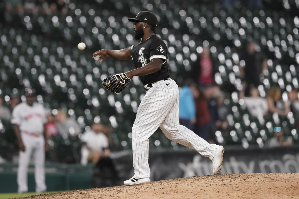 Chicago White Sox position player Josh Harrison pitches during the ninth inning of the team's baseball game against the Boston Red Sox on Thursday, May 26, 2022, in Chicago. The Red Sox won 16-7. (AP Photo/Charles Rex Arbogast)