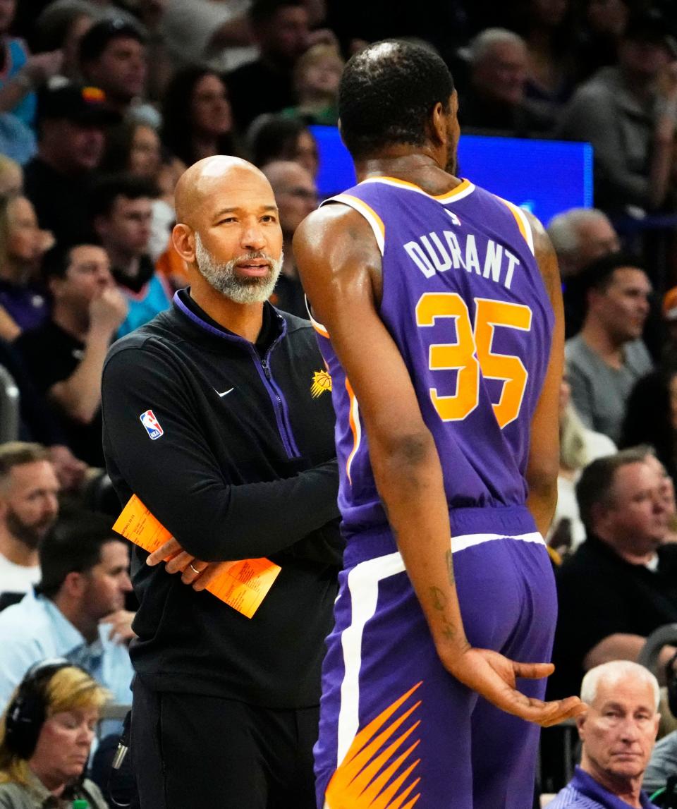 Phoenix Suns head coach Monty Williams talks to Phoenix Suns forward Kevin Durant (35) during his home debut against the Minnesota Timberwolves in the second half at Footprint Center in Phoenix on March 29, 2023.