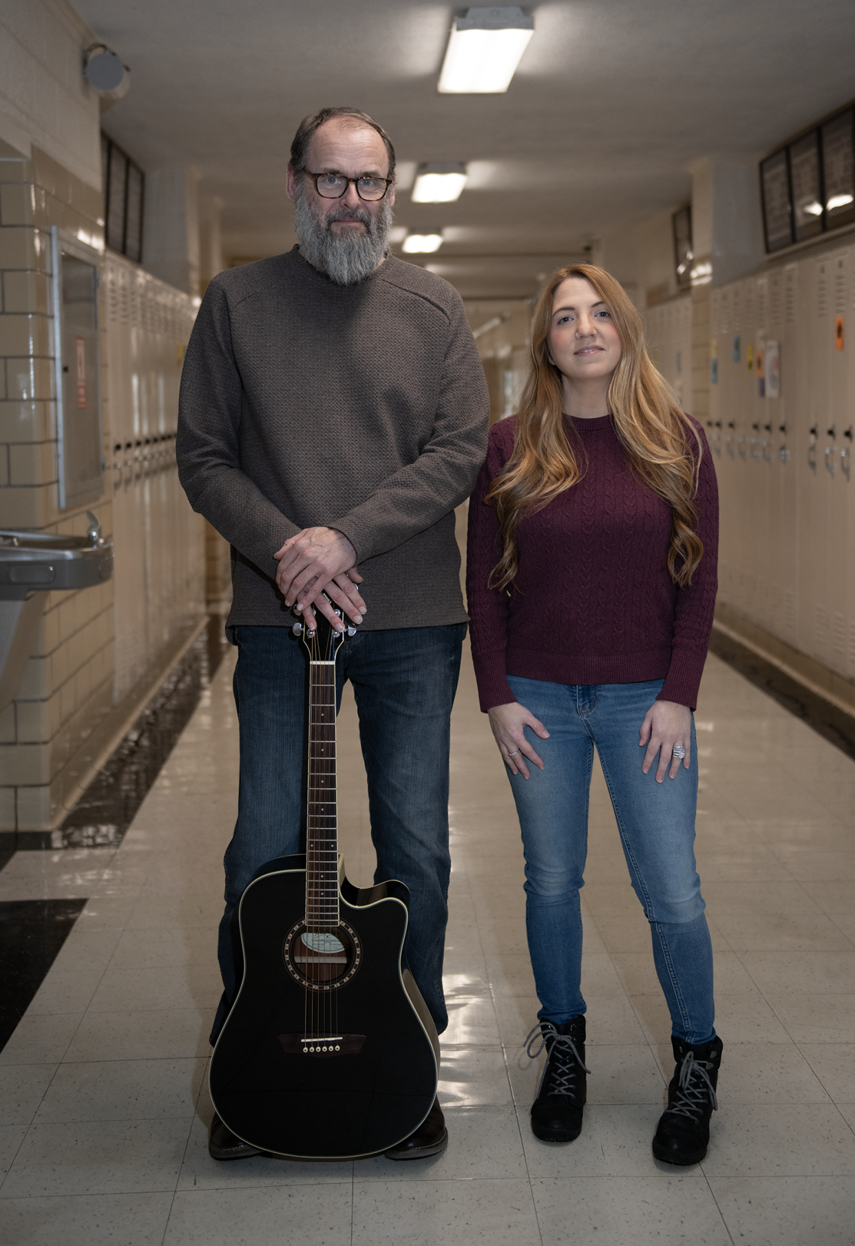 James A. Garfield high school english teacher Steve Howell and 2005 G-Men graduate Amanda Hart reunite at the school in Garrettsville.