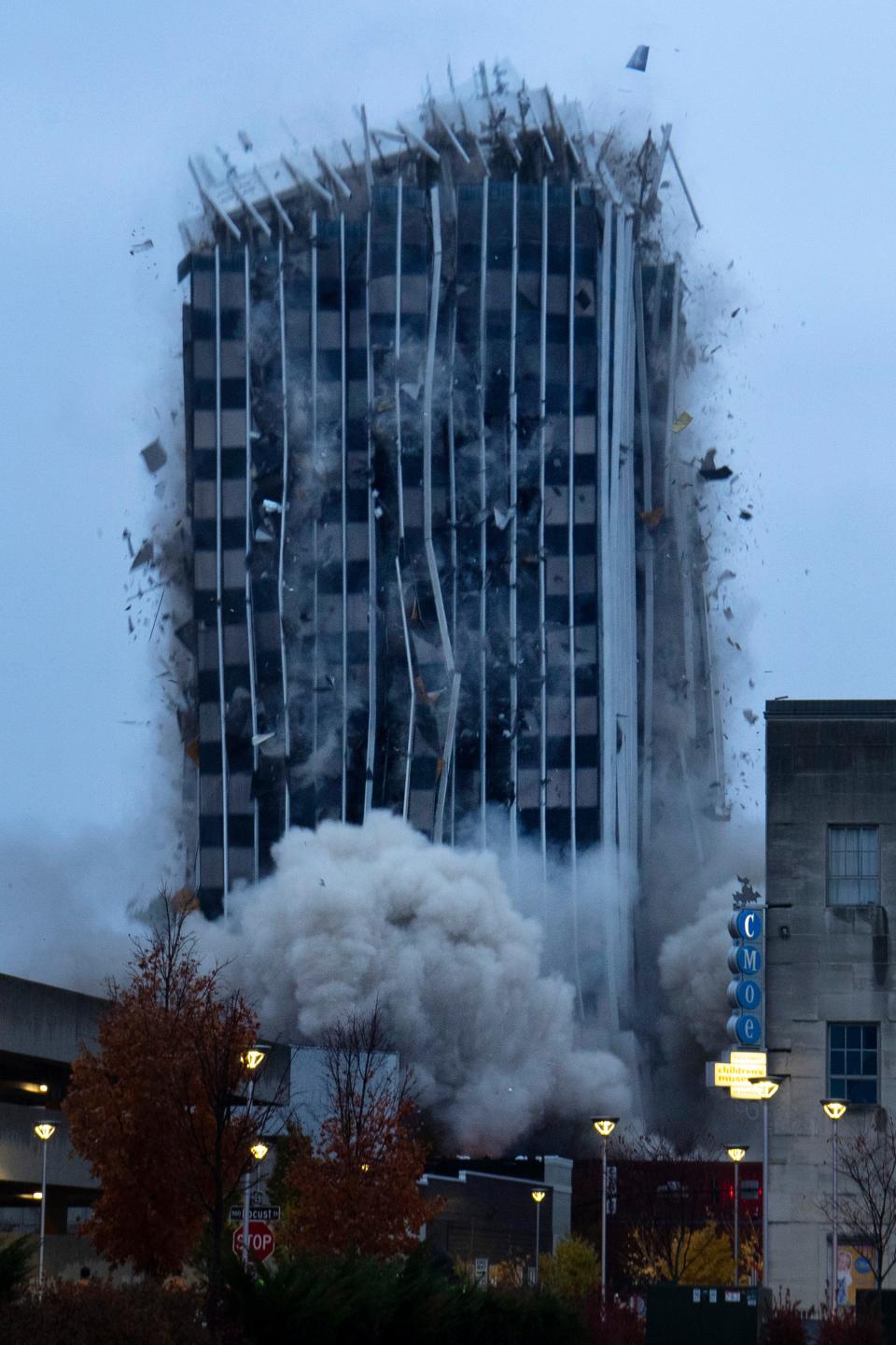 An implosion takes down the 420 Main Building in downtown Evansville, Ind., on Friday morning.