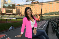 Baltimore Orioles radio and TV announcer Melanie Newman poses for a photograph before a baseball game at Oriole Park at Camden Yards, Tuesday, Sept. 28, 2021, in Baltimore. Newman made history earlier this season when she was part of Major League Baseball's first all-women's broadcast. On Wednesday, the Orioles announcer will receive a bigger national stage when she teams up with Jessica Mendoza on ESPN. (AP Photo/Nick Wass)