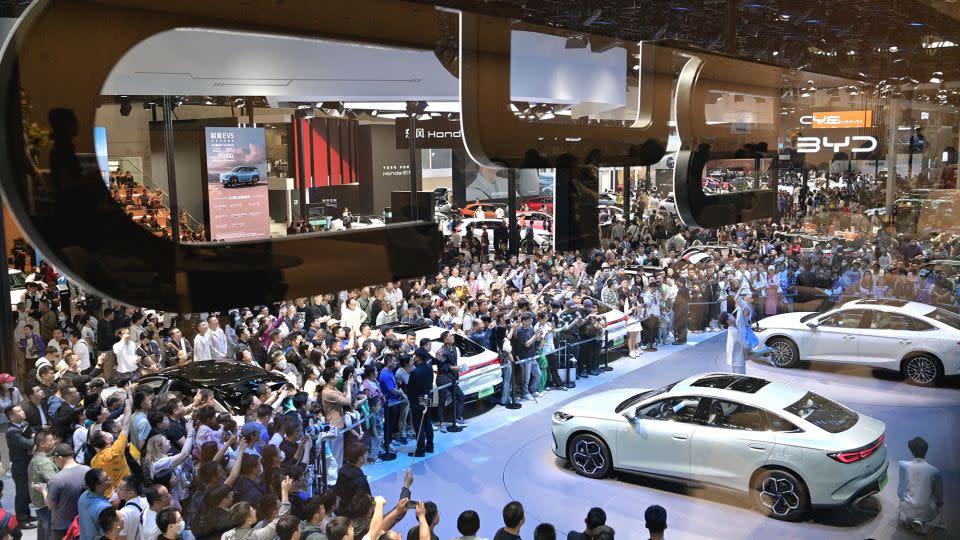 Visitors crowd around BYD vehicles at the 2024 Beijing International Automotive Exhibition in May 2024. - Xinhua/Shutterstock