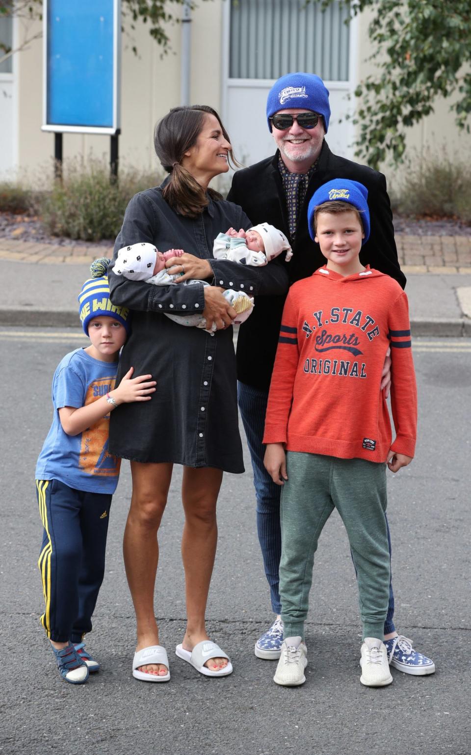 New arrivals: Chris Evans and Natasha Shishmanian with their four children (PA)