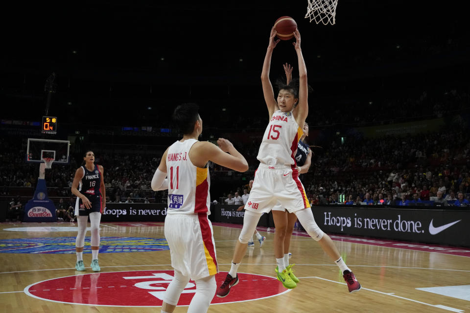 China's Han Xu grabs the ball under the net during their quarterfinal game at the women's Basketball World Cup against France in Sydney, Australia, Thursday, Sept. 29, 2022. (AP Photo/Mark Baker)