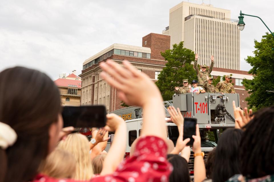 Parade participants wave at the crowd along the parade route during the annual Days of ’47 Parade in Salt Lake City on Monday, July 24, 2023. | Megan Nielsen, Deseret News