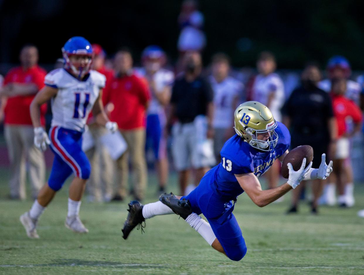 Cardinal Newman's Chris Presto dives for a pass against King's Academy in West Palm Beach, Florida on August 27, 2021. 