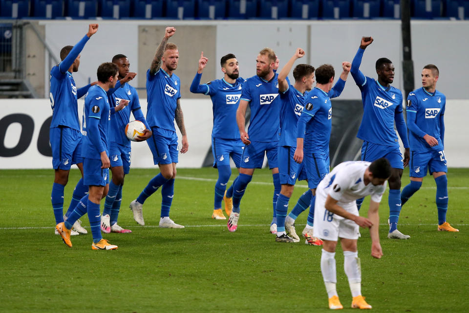 Hoffenheim's players show solidarity with teammate Ryan Sessegnon, who was racially abused on social media earlier this week, during Thursday’s Europa League match against Slovan Liberec. (Harry Langer/Getty Images)