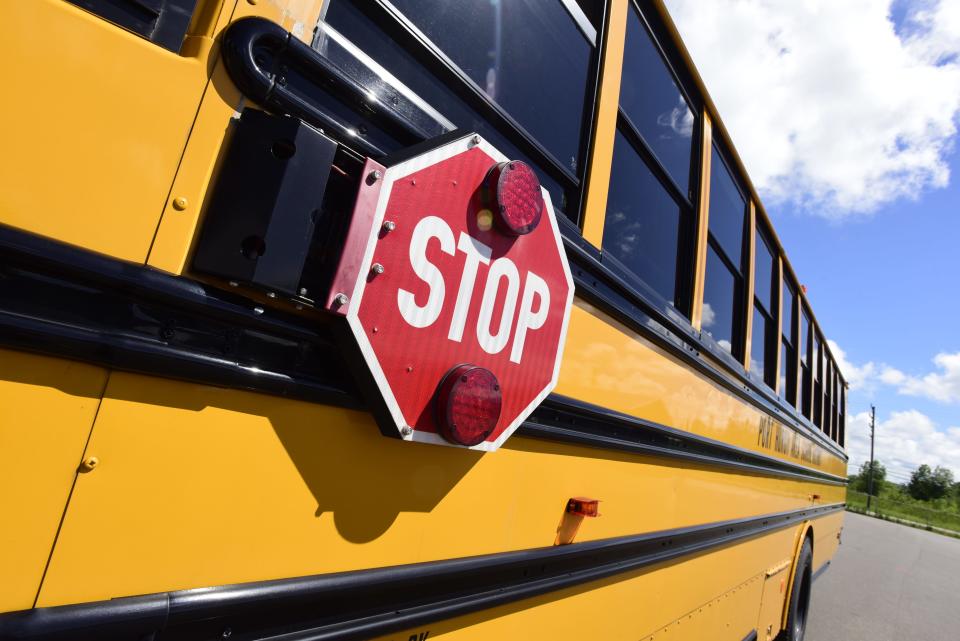 The stop sign on a school bus at the Port Huron Area School District Bus Depot on Thursday, August 11, 2022. Nationwide, schools are experiencing a bus driver shortage. In St. Clair and Sanilac counties, the issue is a mixed bag. Some districts are fine while others are needing coverage.