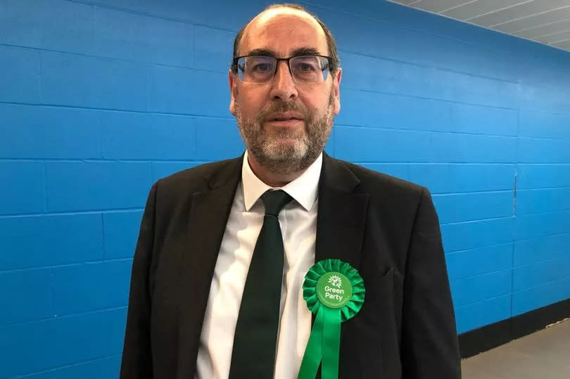 Man in suit with Green party rosette