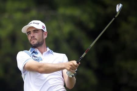 Aug 1, 2015; Gainesville, VA, USA; Troy Merritt watches his shot after teeing off on the 16th hole in the third round of the Quicken Loans National golf tournament at Robert Trent Jones Golf Club. Mandatory Credit: Rafael Suanes-USA TODAY Sports