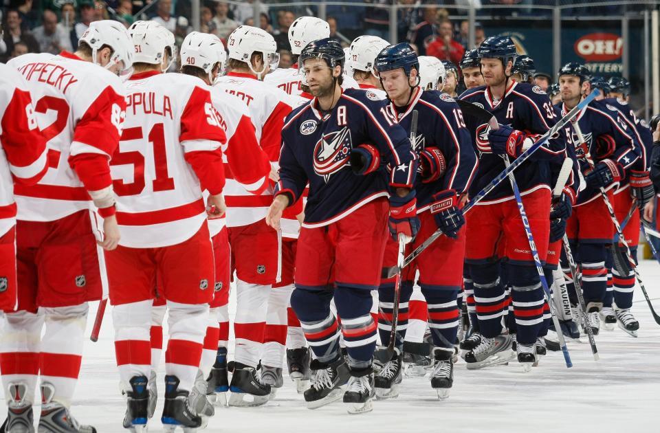 Blue Jackets players congratulate the Red Wings after the 2009 playoff series.