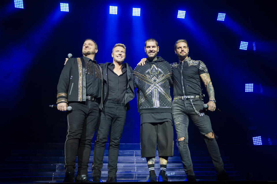 LEEDS, ENGLAND - FEBRUARY 01: EDITORIAL USE ONLY. (L-R) Mikey Graham, Ronan Keating, Shane Lynch and Keith Duffy of Boyzone perform at First Direct Arena on February 01, 2019 in Leeds, England. (Photo by Andrew Benge/Redferns)