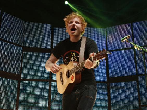 With his tatty T-shirts and high-street jeans, Sheeran has pioneered the lad-from-up-the-road look (Rex)