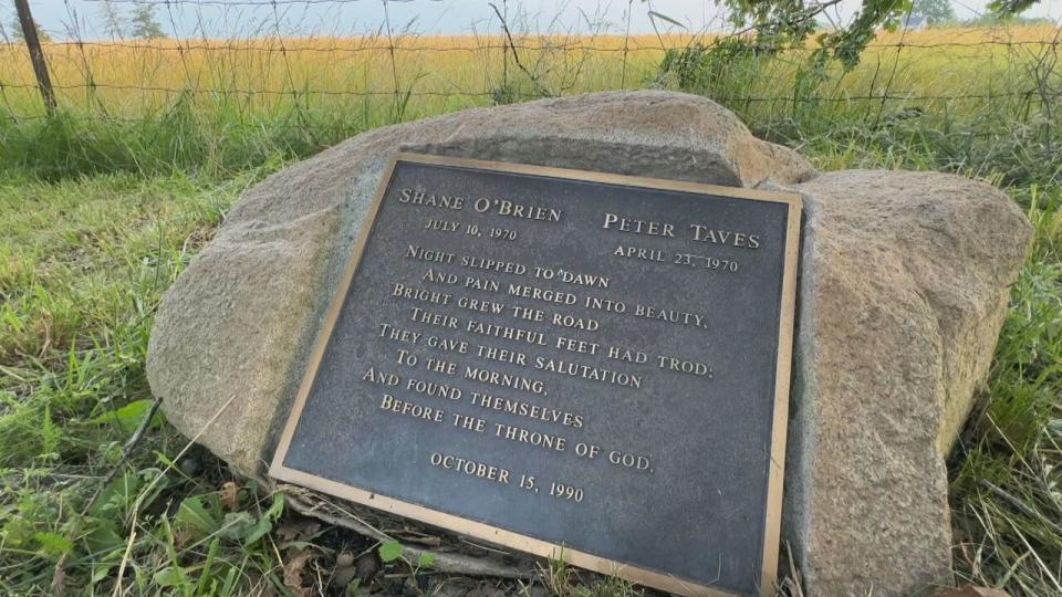 Plaque sits underneath the two trees. The stone was taken from the O'Brien's farm. 