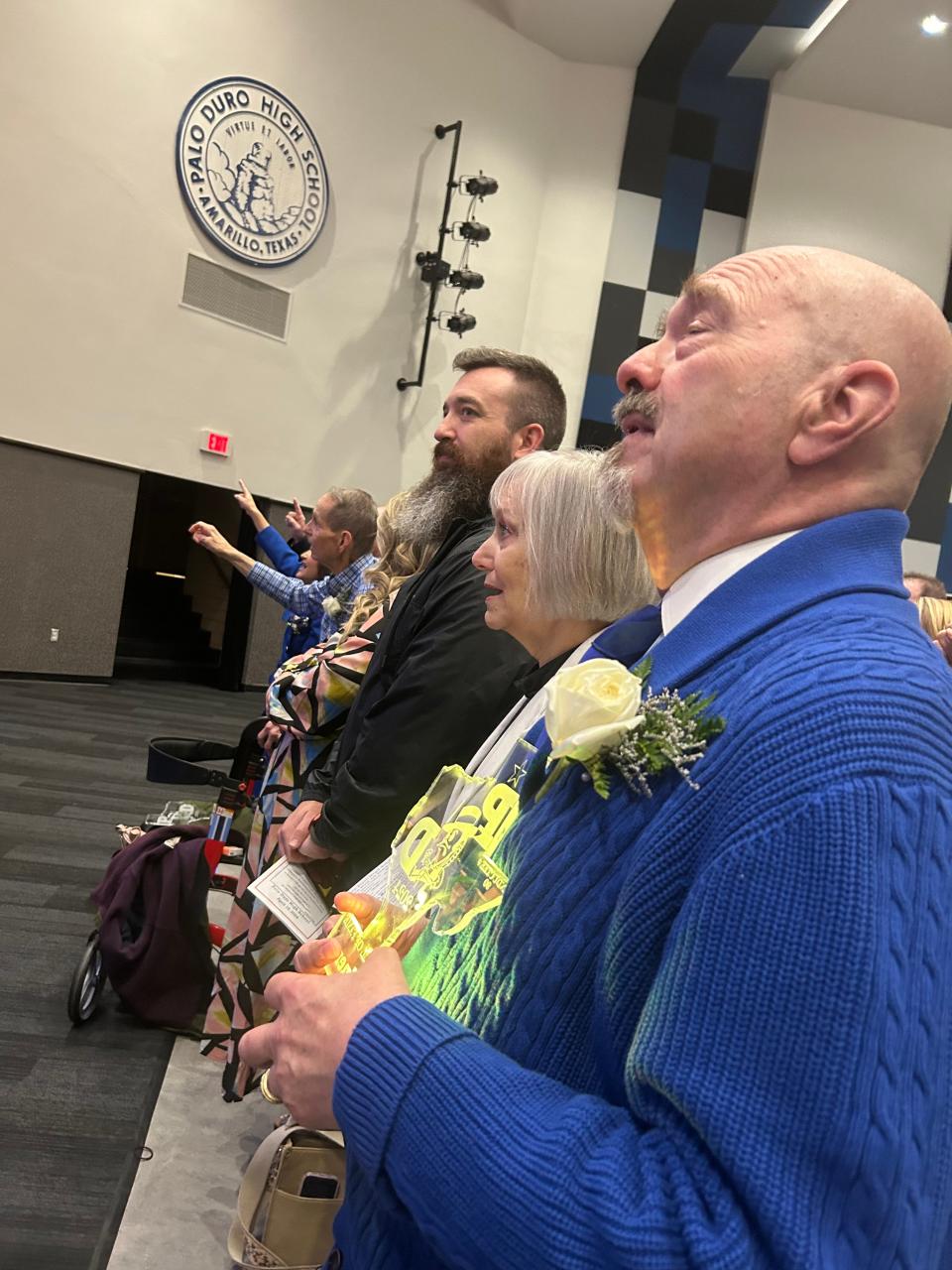 In the forefront, James Gardner, one of the recipients of the honor of being inducted into the Hall of Fame for Palo Duro High School, attends Thursday's event with honoree David Hall (with outstretched arms) and his wife, Pam.