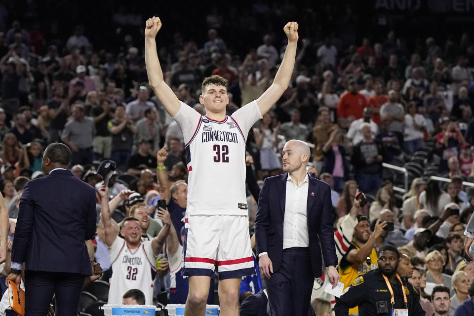 Connecticut center Donovan Clingan celebrates after their win against Miami in a Final Four college basketball game in the NCAA Tournament on Saturday, April 1, 2023, in Houston. (AP Photo/Brynn Anderson)