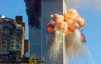 United flight 175 flies directly into World Trade Center tower 2 during a terrorist attack.Photo by Carmen Taylor/WireImage