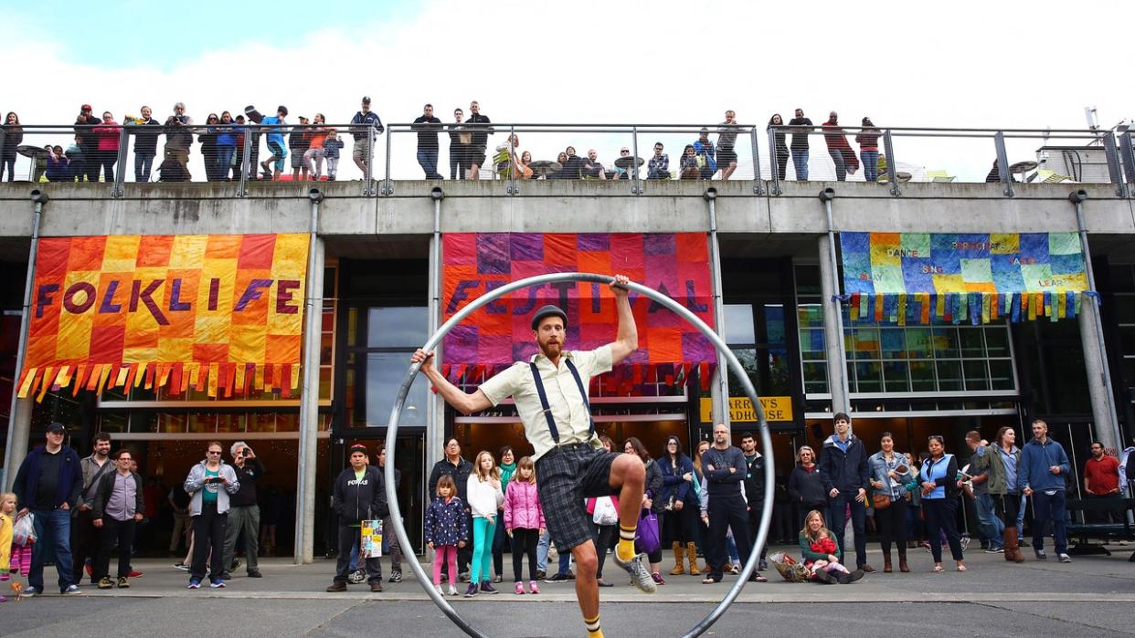 <div>Spectators watch as Ty Vennewitz spins on his Cyr wheel during the 2016 Northwest Folklife Festival at Seattle Center on May 29, 2016.</div> <strong>(Genna Martin, seattlepi.com) (Photo by GENNA MARTIN/San Francisco Chronicle via Getty Images)</strong>