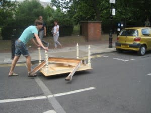 Pushing the furniture into the carpark