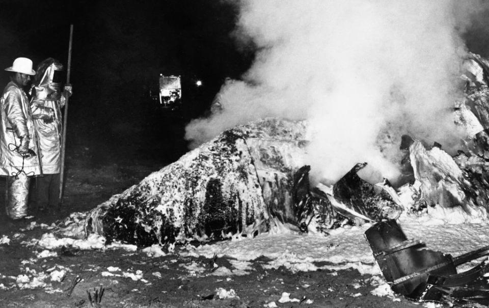 A crew cleaning up debris