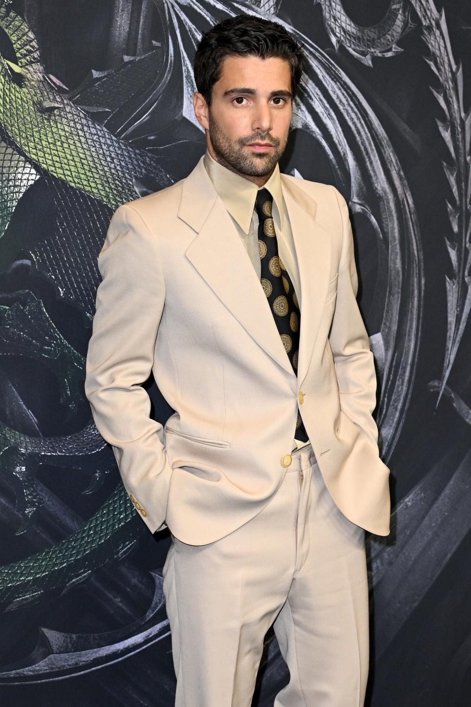Fabien Frankel in a cream suit with a polka dot tie at the Season 2 premiere of 