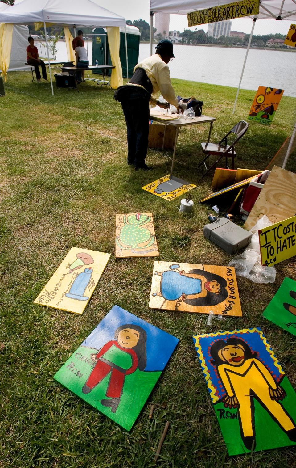 Ruby C. Williams prepares some of her paintings for display at her booth during the annual Mayfaire-by-the-Lake art festival in 2007. Williams, a self-taught artist, had her work displayed at the Smithsonian Anacostia Community Museum in Washington, D.C.