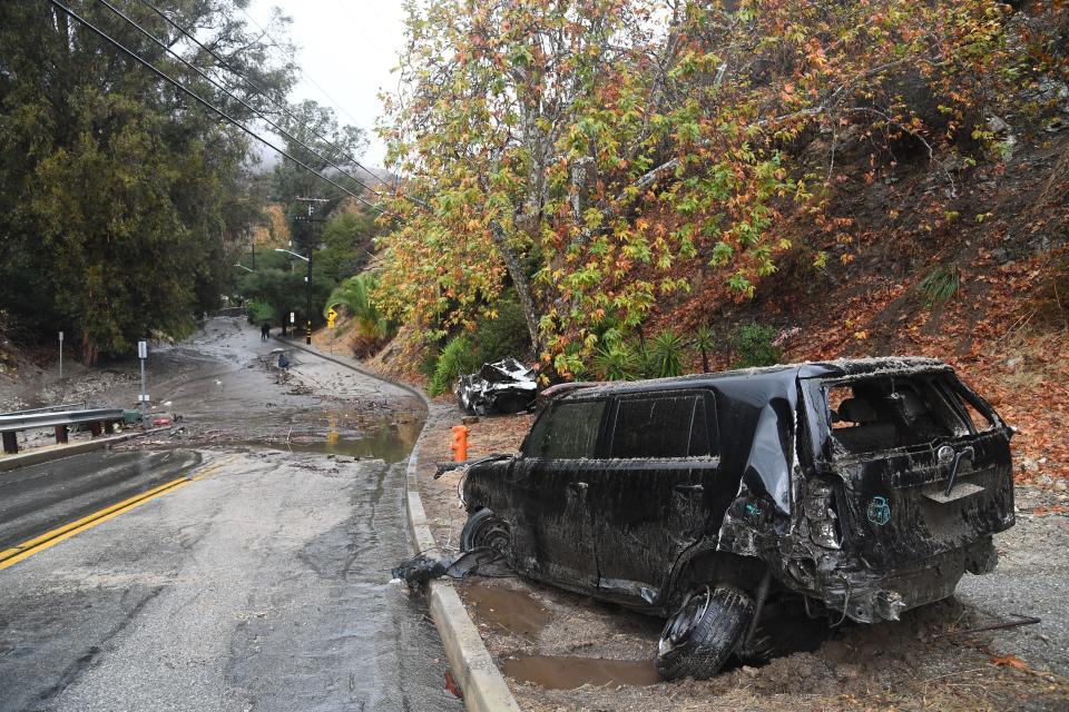 Two cars washed downhill in a rain-driven mudslide in a neighborhood under mandatory evacuation in Burbank, California.