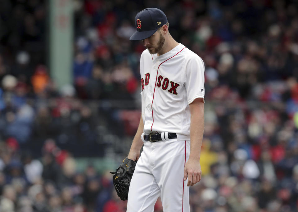 Boston Red Sox starting pitcher Chris Sale walks off the mound after the top of the fourth inning of the home opener baseball game against the Toronto Blue Jays, Tuesday, April 9, 2019, in Boston. (AP Photo/Charles Krupa)