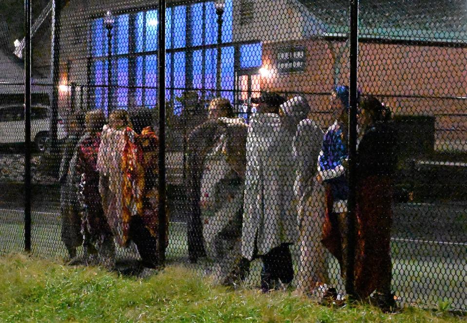 Oneida players watch Peyton Hoang and Sage Hanifin play their doubles match against Jamesville-DeWitt from a neighboring court at Section III's Class B championship match Thursday.