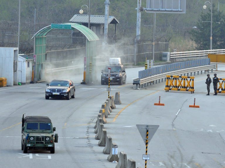 A South Korean military jeep (front) escorts cars leaving Kaesong at a border checkpoint in Paju on May 3, 2013. South Korea on Monday dismissed an "incomprehensible" list of North Korean demands for reviving suspended operations at a jointly-run industrial park