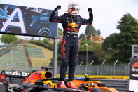 First placed Red Bull's Max Verstappen celebrates at the end of the Emilia Romagna Formula One Grand Prix, at the Imola racetrack, Italy, Sunday, April 18, 2021. (Bryn Lennon/ Pool Via AP)