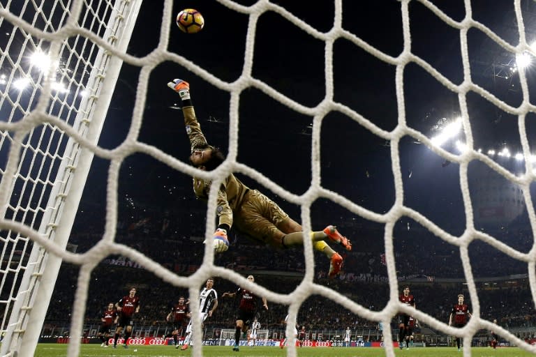 AC Milan's goalkeeper Gianluigi Donnarumma saves a goal during the Italian Serie A football match AC Milan versus Juventus on October 22, 2016