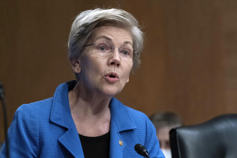 FILE - Sen. Elizabeth Warren, D-Mass., speaks during a Senate Committee on Banking, Housing and Urban Affairs hearing on oversight of the credit reporting agencies at Capitol Hill in Washington, Thursday, April 27, 2023. On Thursday, Warren and Rep. Katie Porter, D-Calif., sent letters to the executives of Intuit, H&R Block, the Free File Alliance, and American Coalition for Taxpayer Rights, seeking information specifics on the amount of money firms have made since being members of the Free File Alliance and information on the number of former government workers who’ve joined their firms in the past two years. (AP Photo/Jose Luis Magana, File)