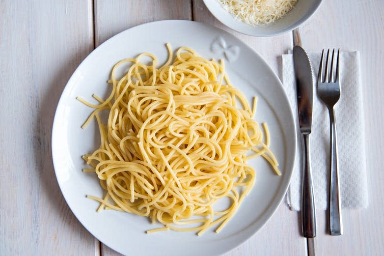 <span class="caption">Participants ate the equivalent of a packet of crisps more after swimming.</span> <span class="attribution"><a class="link " href="https://www.shutterstock.com/image-photo/boiled-italian-pasta-on-plate-spaghetti-605688596" rel="nofollow noopener" target="_blank" data-ylk="slk:Natali LaRush/ Shutterstock;elm:context_link;itc:0;sec:content-canvas">Natali LaRush/ Shutterstock</a></span>