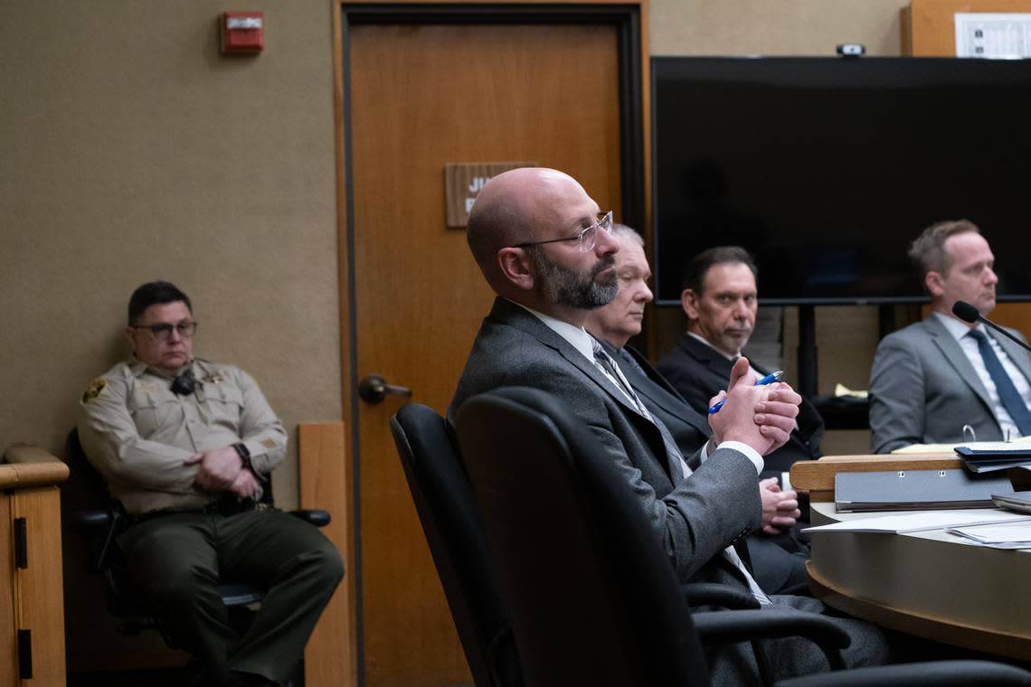 From left to right, a bailiff, San Luis Obispo County Deputy District Attorney Ben Blumenthal, defendant Stephen Deflaun, and defense attorneys Ray Allen and Tim Osman sit in the murder trial against Deflaun on March 23, 2023.