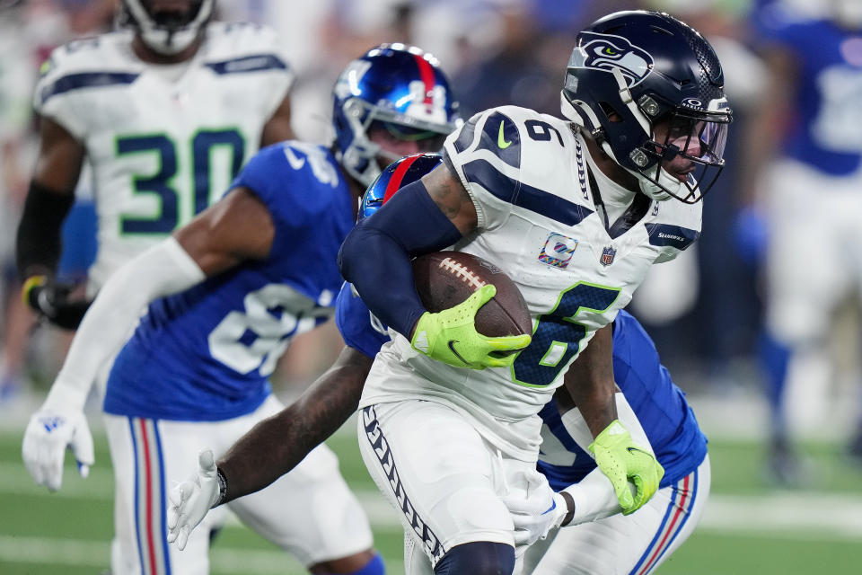 Seattle Seahawks safety Quandre Diggs (6) runs back an interception 21 yards against the New York Giants during the fourth quarter of an NFL football game, Monday, Oct. 2, 2023, in East Rutherford, N.J. (AP Photo/Frank Franklin II)